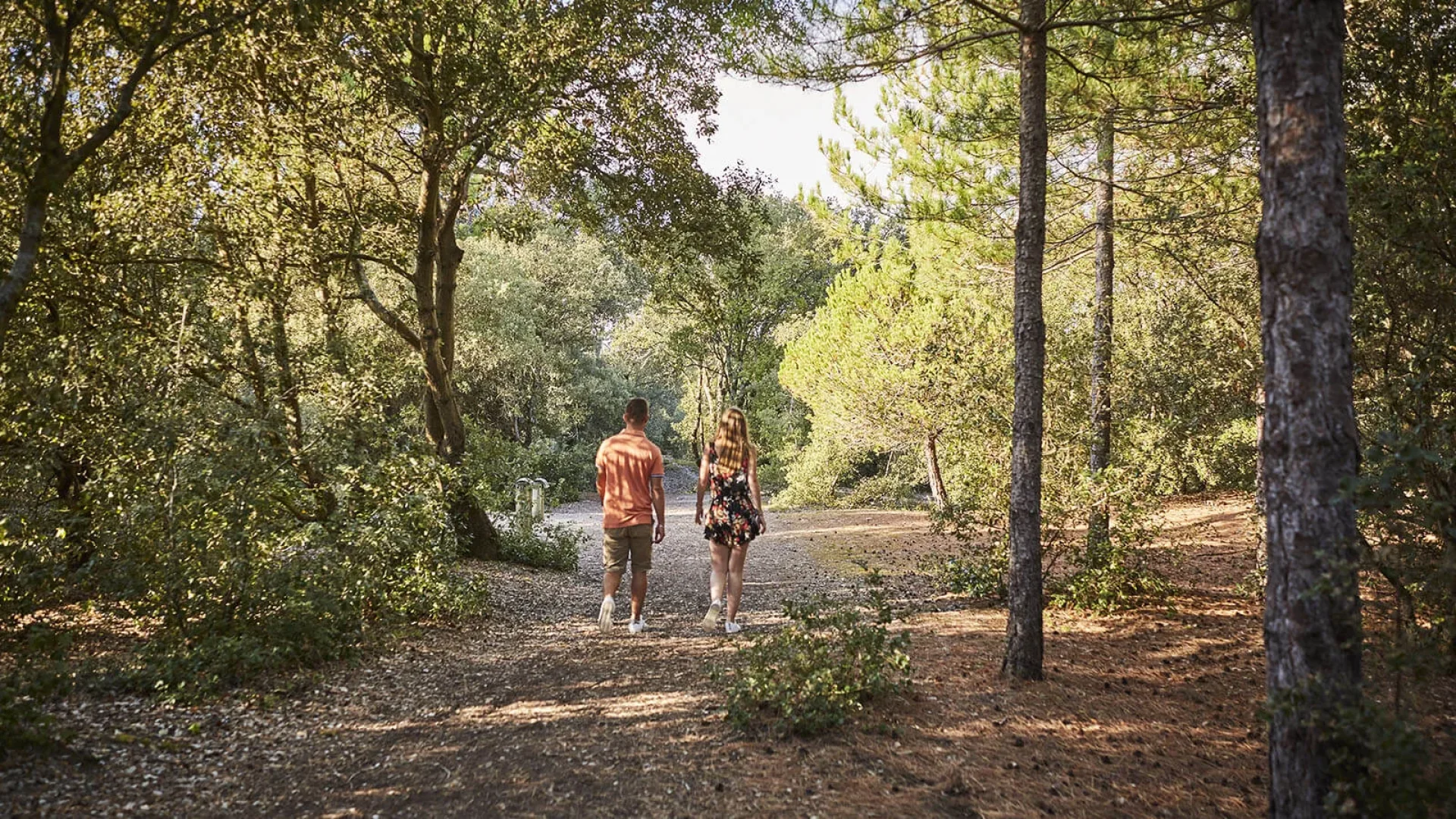 couple walking in the forest in vendée