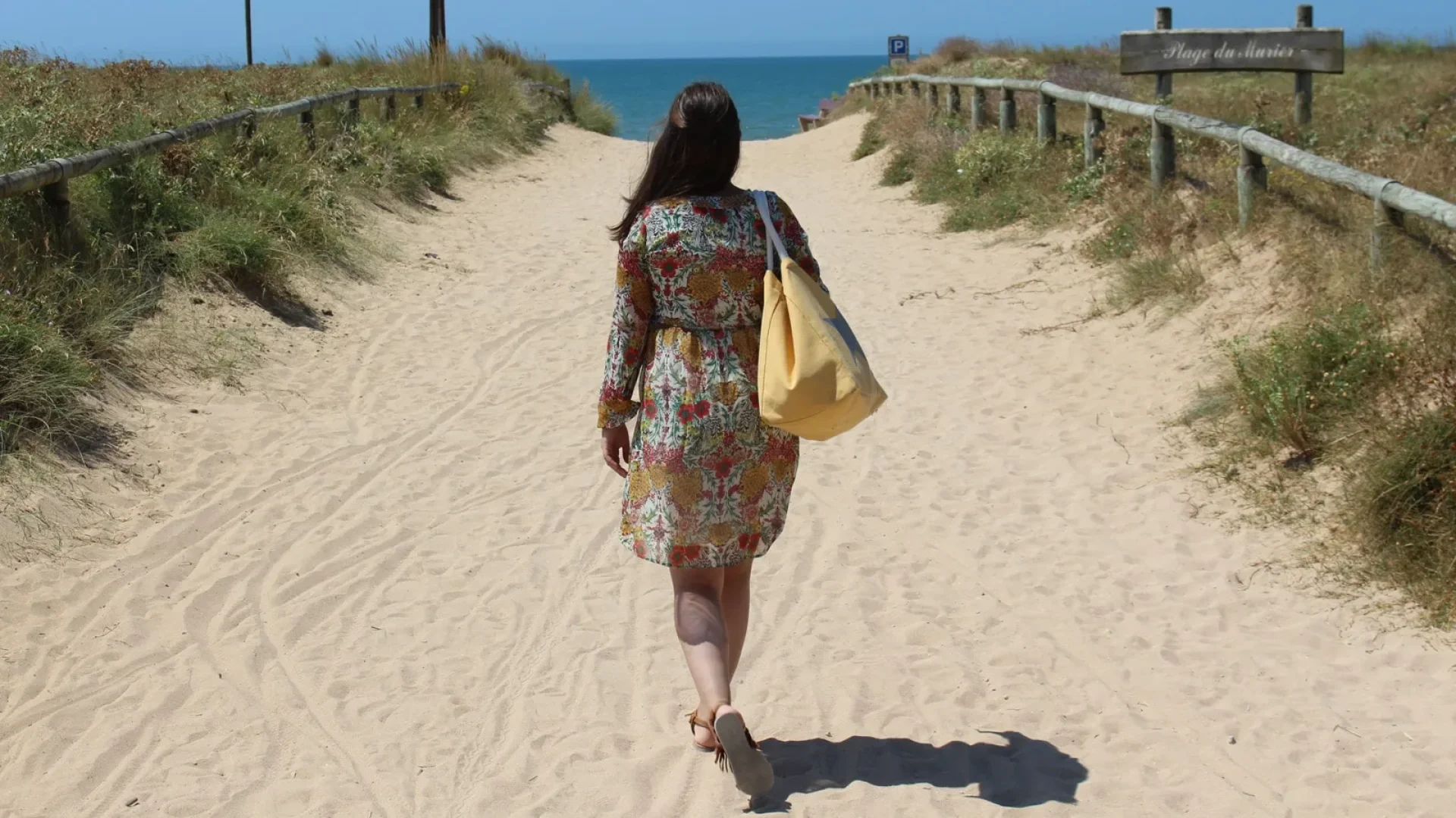 woman walking towards la plage (beach) du murier in notre dame de monts